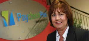 Anne Reilly in Paycheck Plus office discussing outsourcing the payroll function