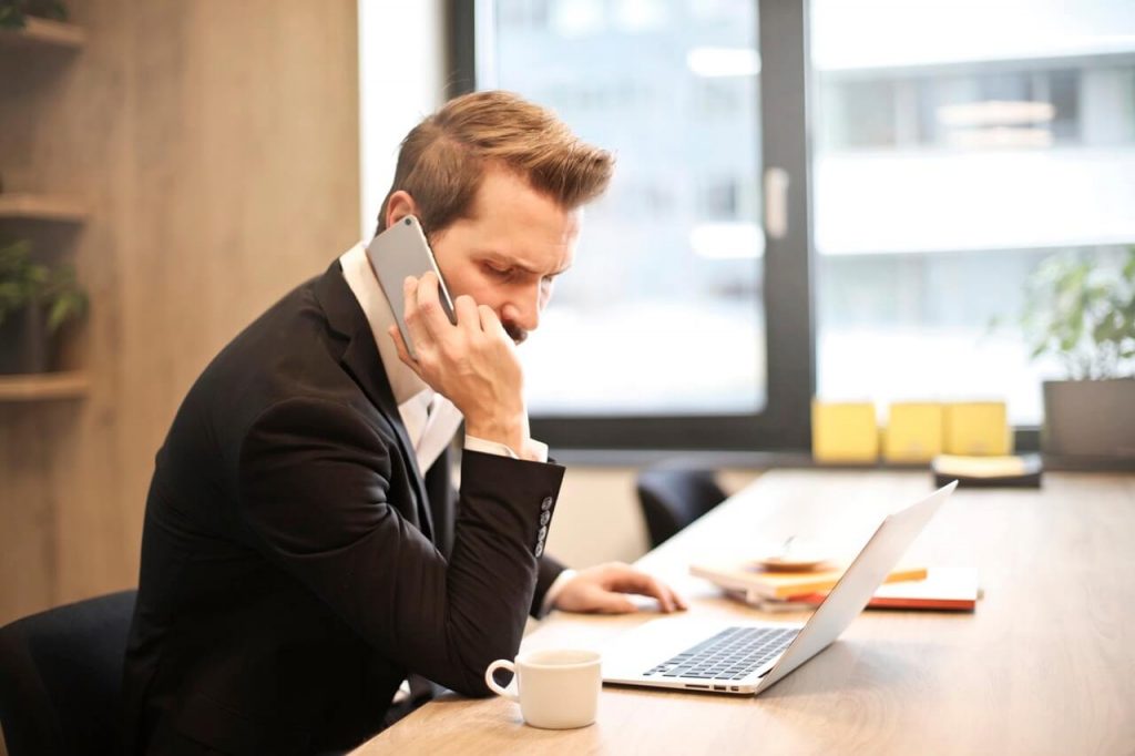 Man in Office on Phone | Paycheck Plus P60 and P35 Deadlines Clarification